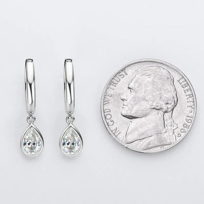 Pear cut moissanite hoop earrings in 925 sterling silver with secure closure and bright white gold finish