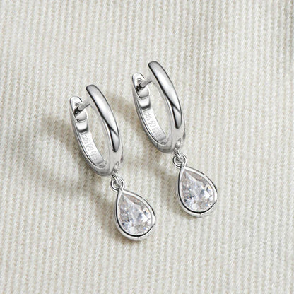 Pear cut moissanite hoop earrings in 925 sterling silver with teardrop design and secure closure