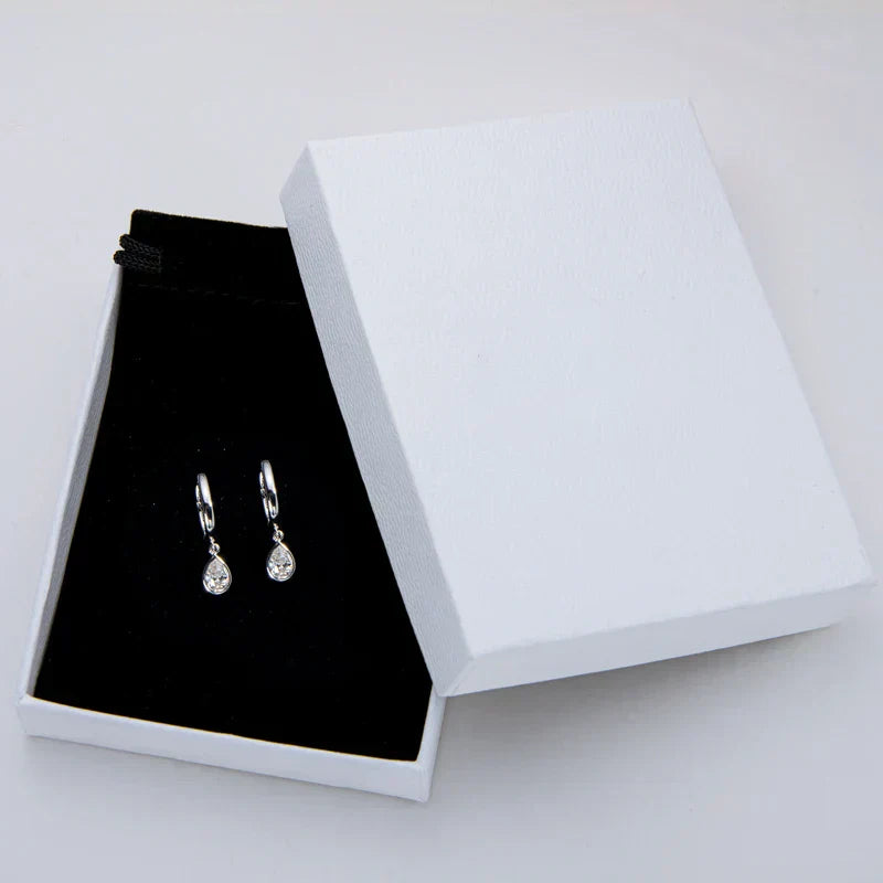 Pear cut moissanite hoop earrings in 925 sterling silver with teardrop design and high brilliance stones